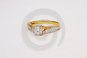 Gold ring with diamond isolated on white background