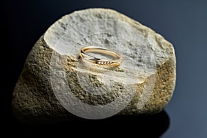 Gold ring with diamonds on the stone