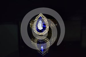 Gold ring with sapphire Is an expensive and beautiful fashion ring photo