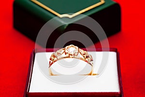 Gold ring with white zirconia enchased