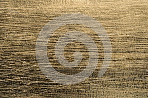 Gold scratched metallic paper background texture