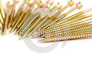 Gold screws isolated on white background