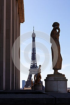 Gold Sculptures on Trocadero with Eiffel Tower on background, Paris