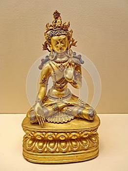 The gold seated meditative Buddha