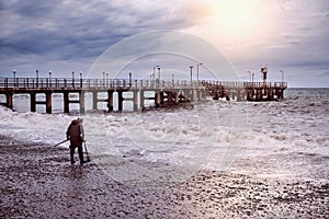 Gold seeker on the sea coast.