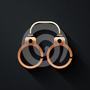 Gold Sexy fluffy handcuffs icon isolated on black background. Fetish accessory. Sex shop stuff for sadist and masochist photo