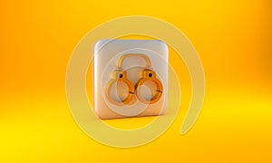 Gold Sexy fluffy handcuffs icon isolated on yellow background. Fetish accessory. Sex shop stuff for sadist and masochist