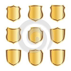 Gold shield shape icons set. 3D golden emblem signs isolated on white background. Symbol of security, power, protection