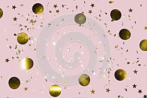 Gold shiny flying confetti on a pink background festive backdrop