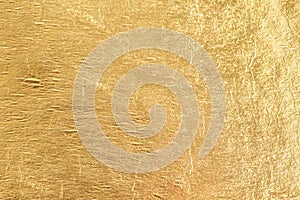 Gold shiny foil background, yellow gloss metallic texture