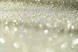 Gold and silver abstract bokeh lights. Shiny glitter background with copy space. New year and Christmas concept. Sparkling