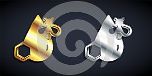 Gold and silver Bee and honeycomb icon isolated on black background. Honey cells. Honeybee or apis with wings symbol