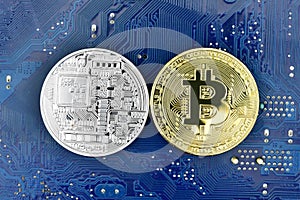 Gold and Silver bitcoin and motherboard