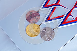 Gold silver and bronze medal for 1st 2nd and 3rd place. Sport photo. White edit space