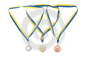 Gold, silver, and bronze medals isolated on white