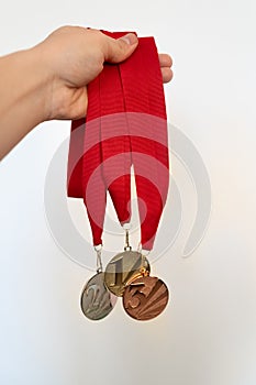 Gold, silver and bronze medals with numbers on white isolated background