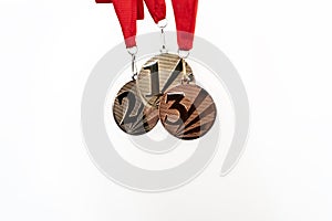 Gold, silver and bronze medals with numbers on white isolated background