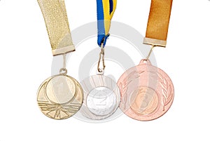 Gold, silver, and bronze medals on white