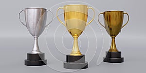 Gold silver bronze trophy cup with dual handle on grey background. Shiny metallic reward. 3d render