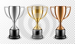 Gold silver and bronze winners cups. Shiny champion trophy, ceremony awarding metallic sport prize. Vector set photo