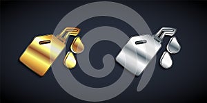 Gold and silver Canister for motor machine oil icon isolated on black background. Oil gallon. Oil change service and