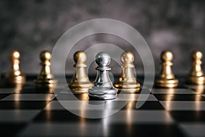 Gold and Silver Chess on chess board game for business metaphor leadership concept