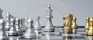 Gold and silver Chess figure on Chessboard against opponent or enemy. Strategy, Conflict, management, business planning, tactic,