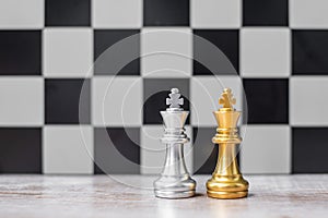 Gold and silver Chess King figure on Chessboard against opponent or enemy. Strategy, Conflict, management, business planning,