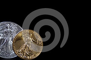 A gold and silver coin on black background