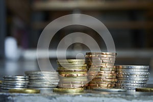 Gold and silver coin stack on blur background