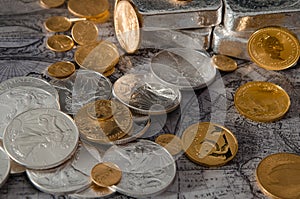 Gold & Silver Coins with Silver Bars on map