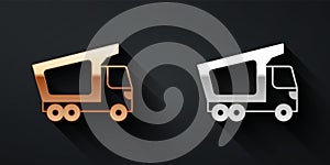 Gold and silver Delivery cargo truck vehicle icon isolated on black background. Long shadow style. Vector