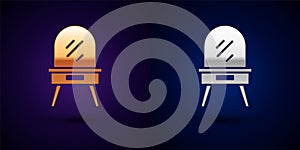 Gold and silver Dressing table icon isolated on black background. Vector