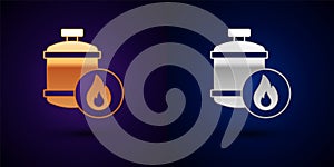 Gold and silver Propane gas tank icon isolated on black background. Flammable gas tank icon. Vector