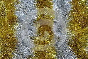 Gold and silver tinsel bright glittering New Year or Christmas background