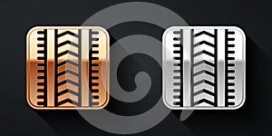 Gold and silver Tire track icon isolated on black background. Long shadow style. Vector
