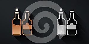 Gold and silver Whiskey bottle icon isolated on black background. Long shadow style. Vector