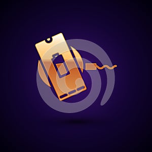 Gold Smartphone charging on wireless charger icon isolated on black background. Charging battery on charging pad. Vector