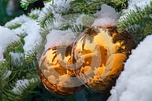 Gold Snow Covered Christmas Tree Ornaments Reflect Santa Fe Adobe Buildings