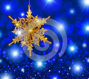 Gold Snowflake Star on Blue Stars Background