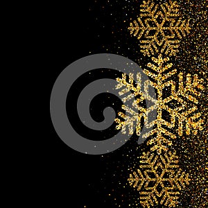 Gold snowflakes and glitter on dark background for Merry Christmas and Happy New Year greeting card.