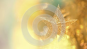Gold star Christmas decoration with bokeh gold color