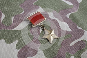 The Gold Star medal is a special insignia that identifies recipients of the title Hero in the Soviet Union on Soviet camouflag