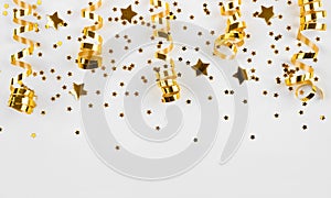 Gold stars confetti and curled ribbons isolated on white background