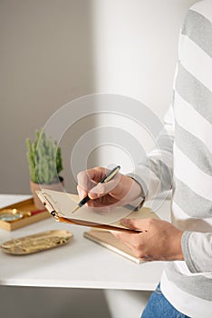 Gold stationaries and cactus. Good plant for improving office air environment