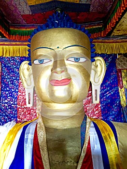 Gold statue of seated Shakyamuni Buddha at Shey Palace.