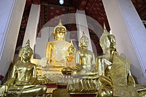 Gold statues next to each other in Wat Arun temple in Bangkok, Thailand