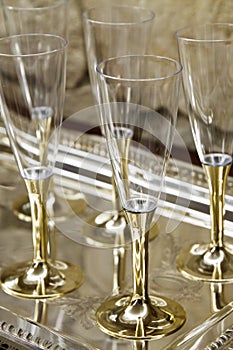 Gold stemmed champagne glasses