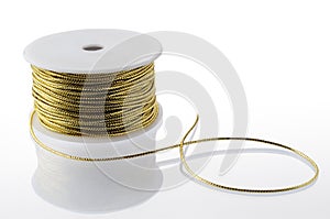 Gold string spool