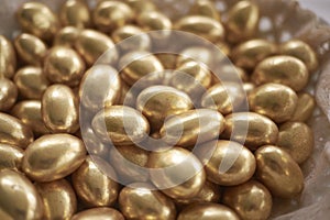 Gold sugared almonds for a marriage